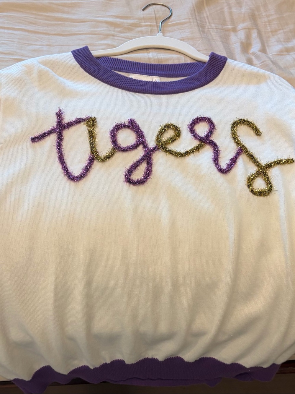 QUEEN OF SPARKLES White Knit Sweatshirt with Purple and Gold Tinsel Script